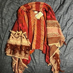 FREE PEOPLE Cozy, bohemian vest! Has never been worn-still has the tag on it.